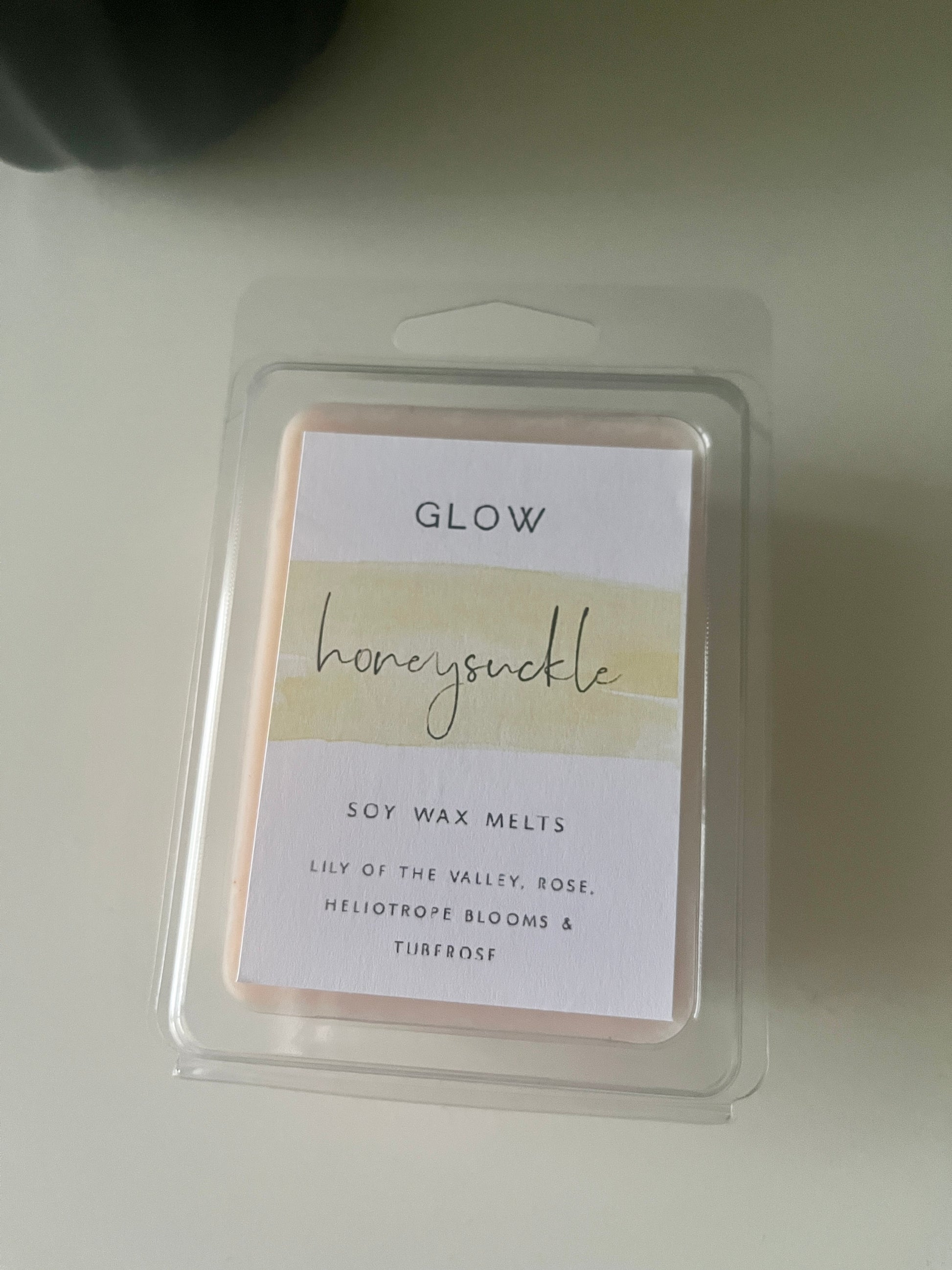 A package of glow clamshells labelled Honeysuckle with 6 orange wax cubes